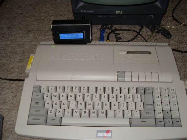 CPC 464+ modded with 128 Ko RAM and the HxC floppy emulator running